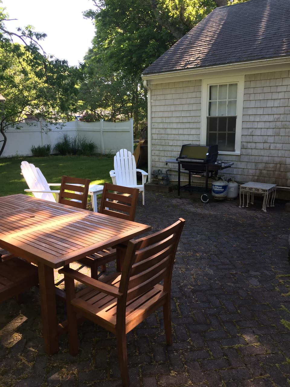 Outdoor furniture, 80" table, 6 chairs, 3 burner grille and two Adirondack chair