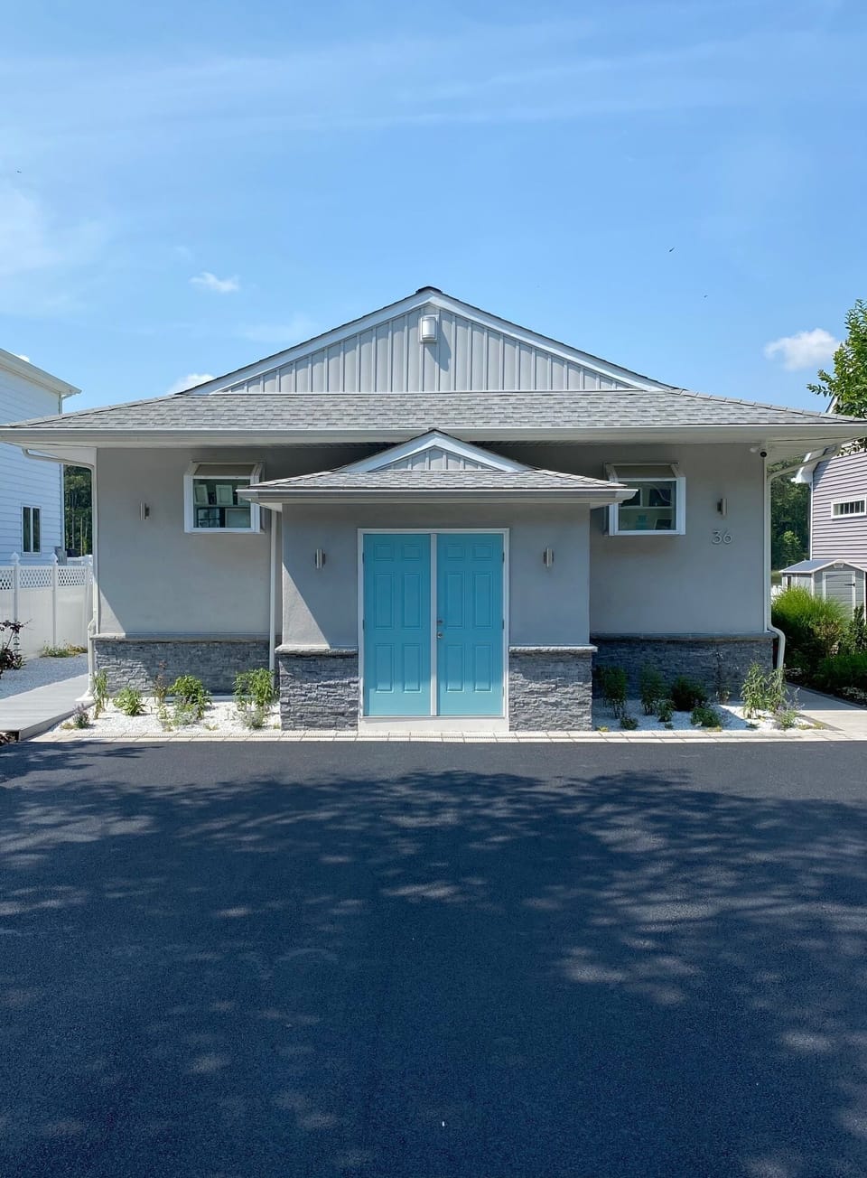 Front of house with storage shed and parking area