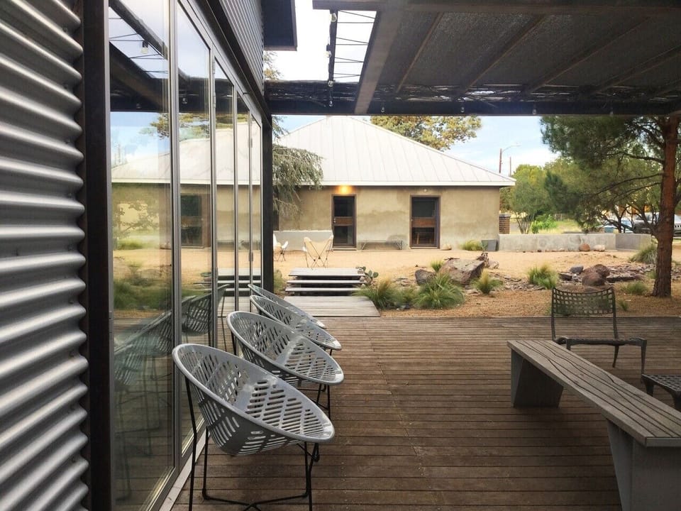 Outdoor Deck Seating - Solair Chairs, Casa Grande across the dry rock bed.