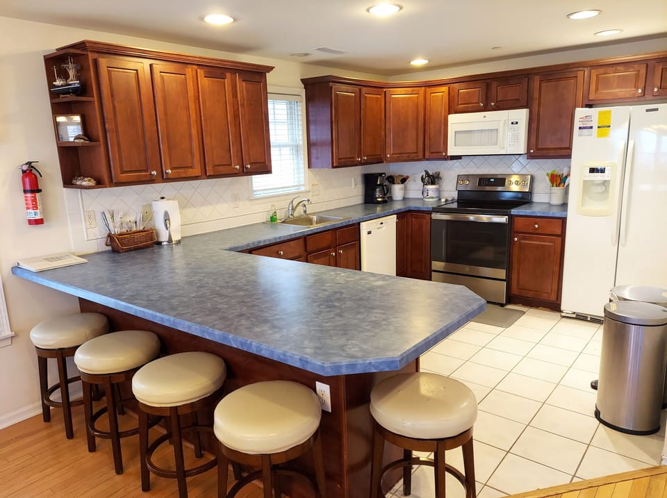 Spacious and well stocked kitchen (see later photos) with 5 counter stools