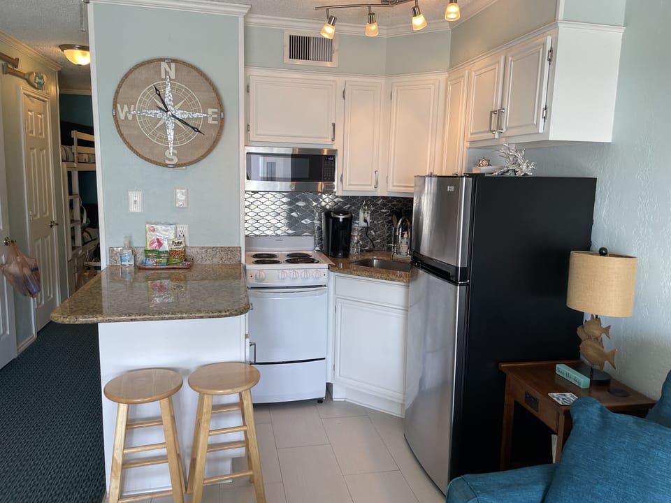 Kitchen- Basic kitchen ware & utensils.
4 coffee pods & sweeteners provided.