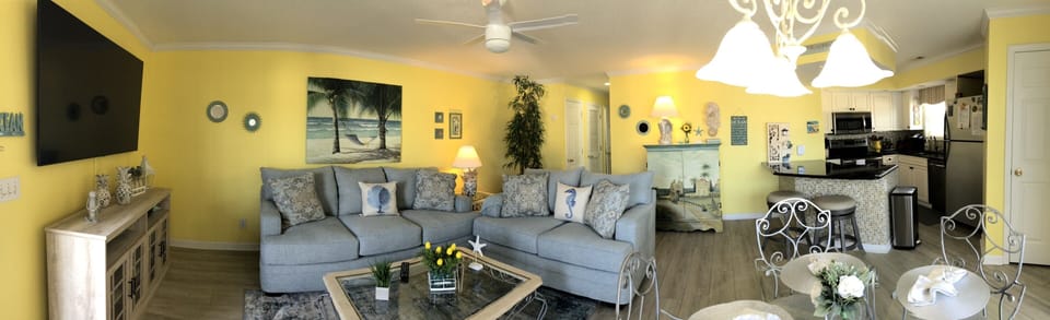 View of living, dining and kitchen area