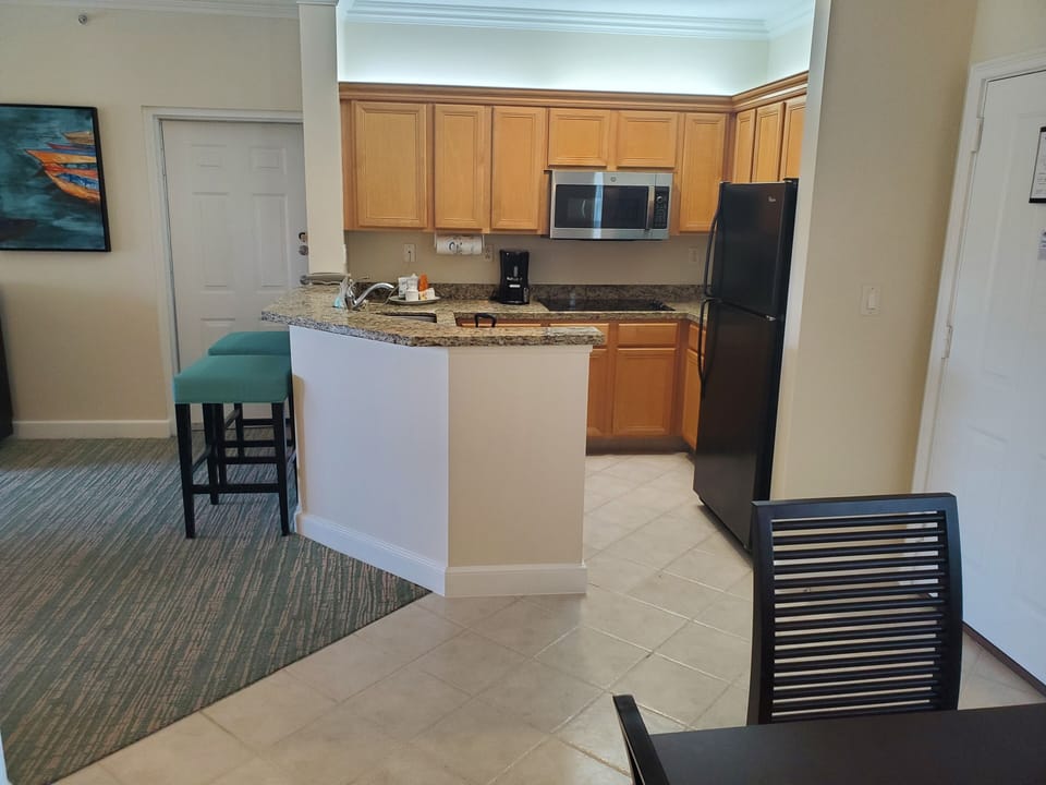 Large 1br, looking at kitchen from dining room, door on left goes to smaller 1br