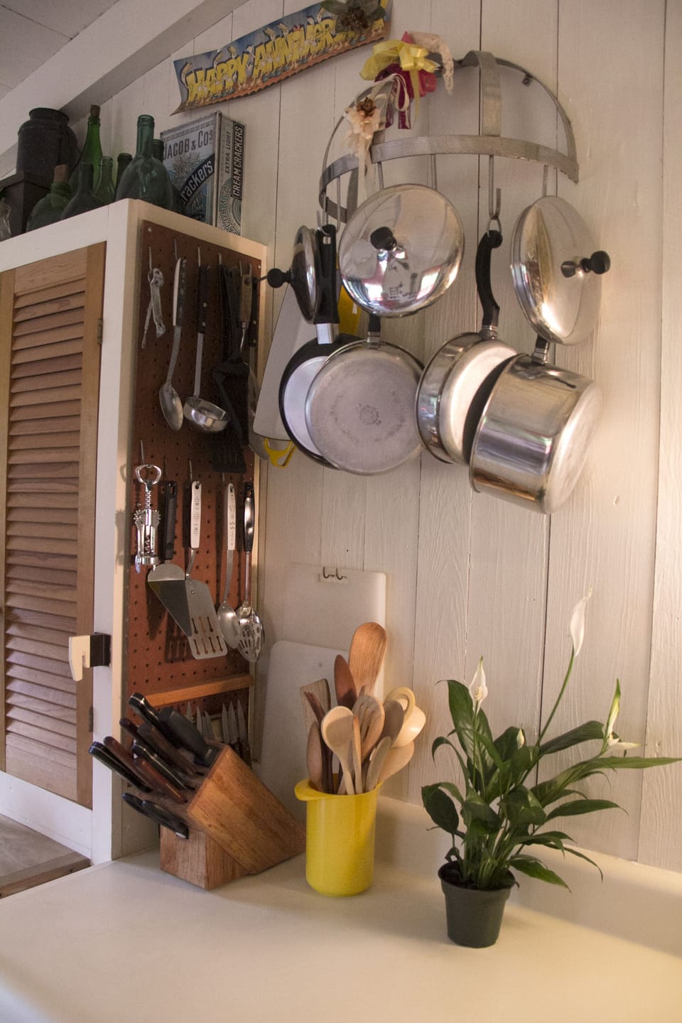 Kitchen spice and condiment cabinet on left