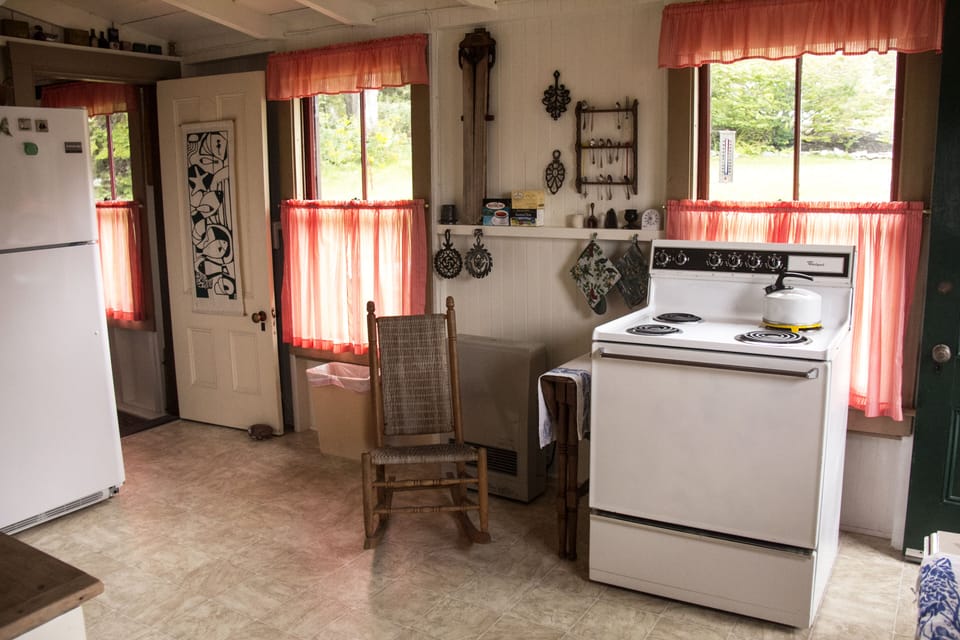 Kitchen and back hall door on left New stiove not in this photo has 5 burners