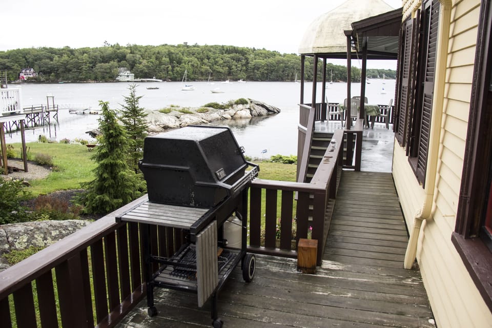 Side porch and grill leading to front porch