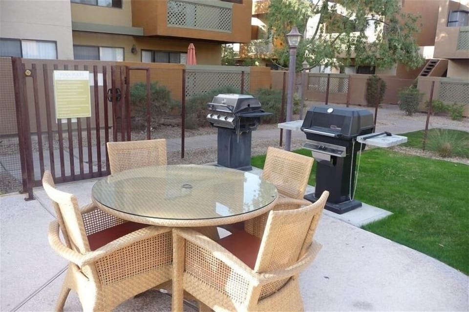 there are grills and tables at both pools