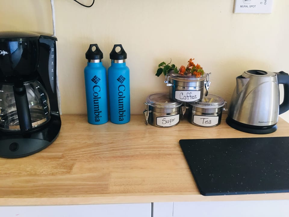Free Coffee, Tea, Sugar, Milk, Bottled H20 & Complimentary Welcome Breakfast