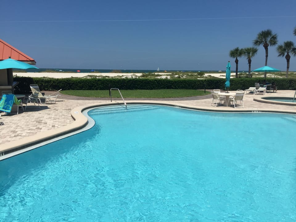 Beautiful pool and spa right on the beach! Never blocked from sun by building