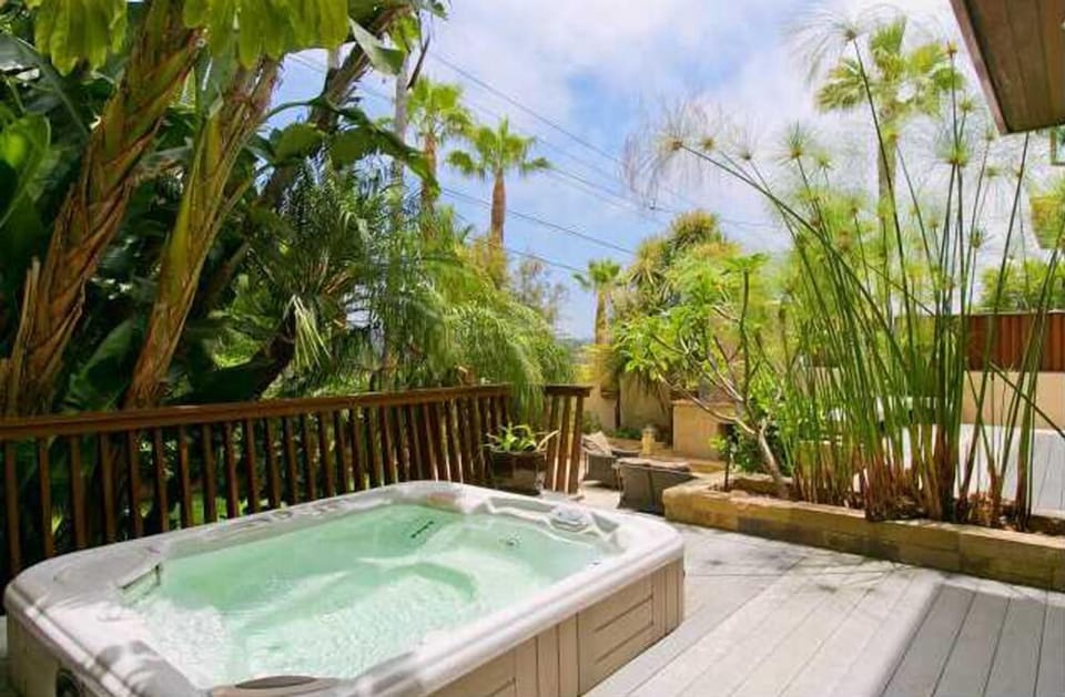 Hot tub surrounded by plants... just off the master bedroom.
