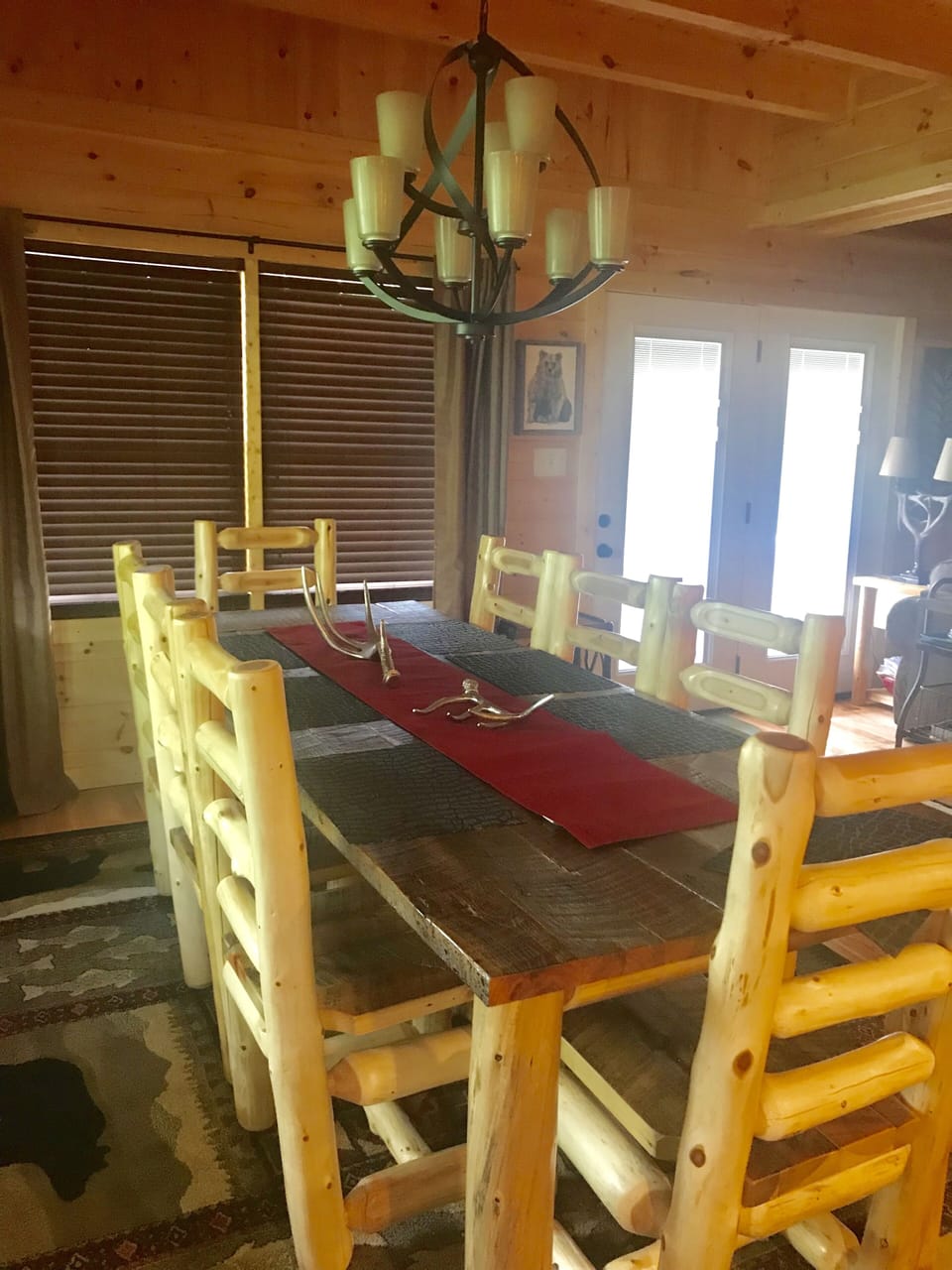 Beautiful 8-foot dining table with 8 large chairs in large open dining area 
