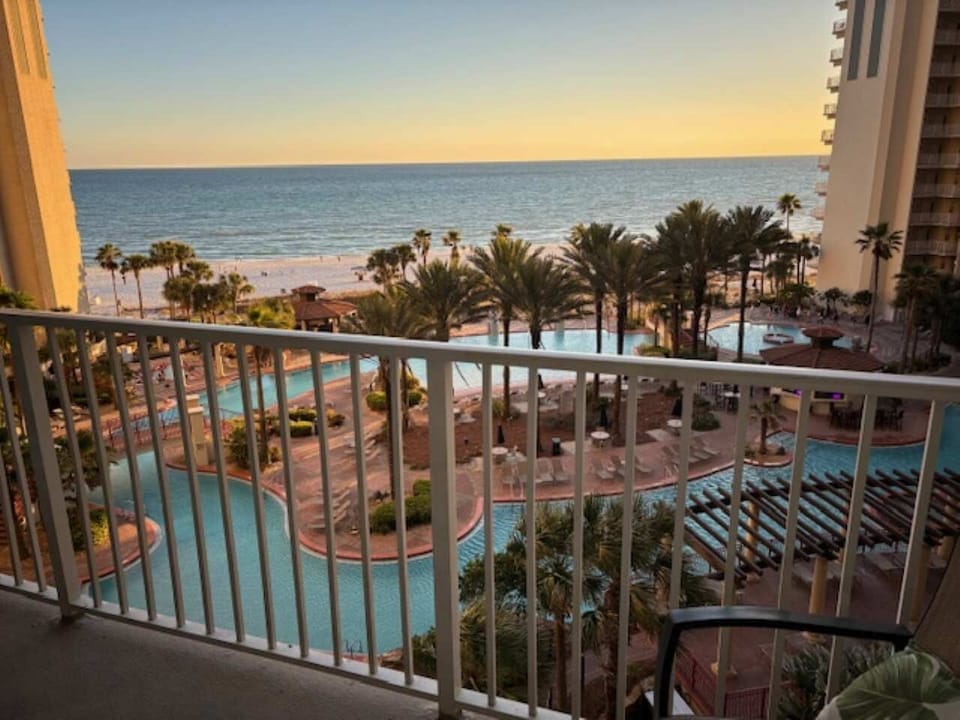 BALCONY OVERLOOKING POOL AND BEACH