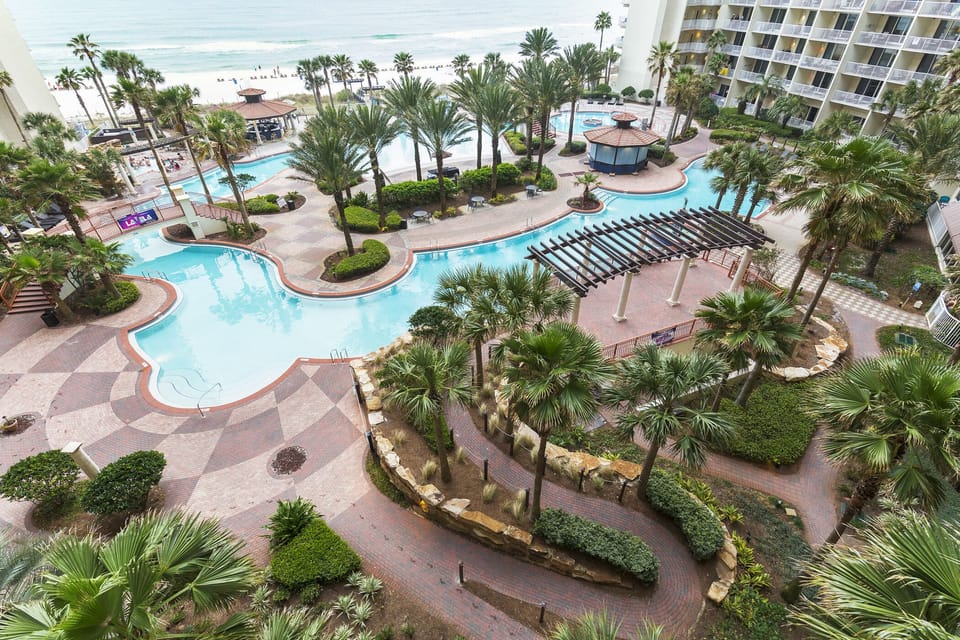 VIEW OF POOL AND BEACH FROM UNIT
