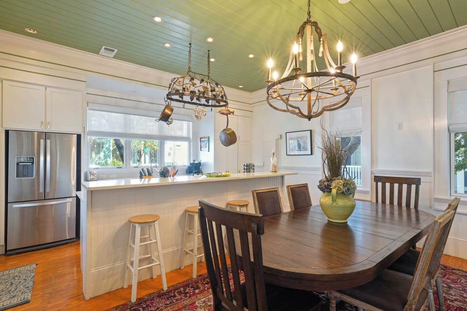 DINING NEXT TO KITCHEN. ADDITIONAL BAR SEATING FOR FOUR