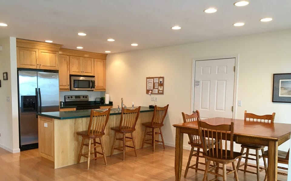 View of kitchen and dining areas from living room.