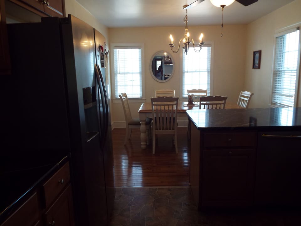 Eat in kitchen seats 6 at table, 3 bar stools at counter