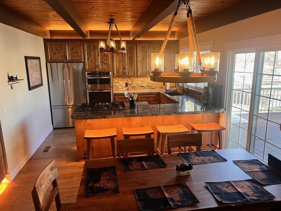 Kitchen with large table seats 6 and island seats 4