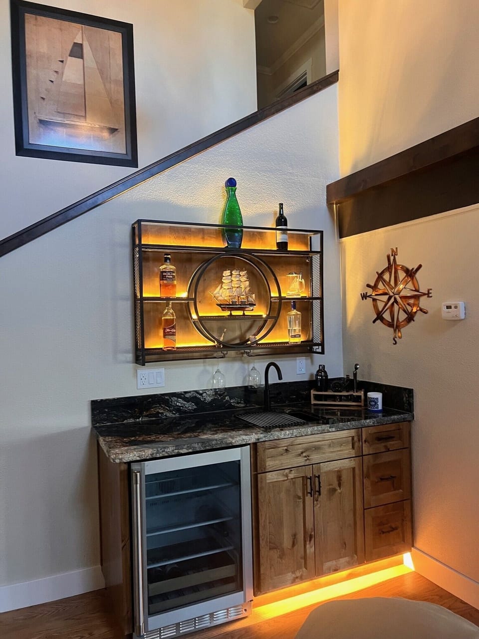 wet bar in living room with fridge