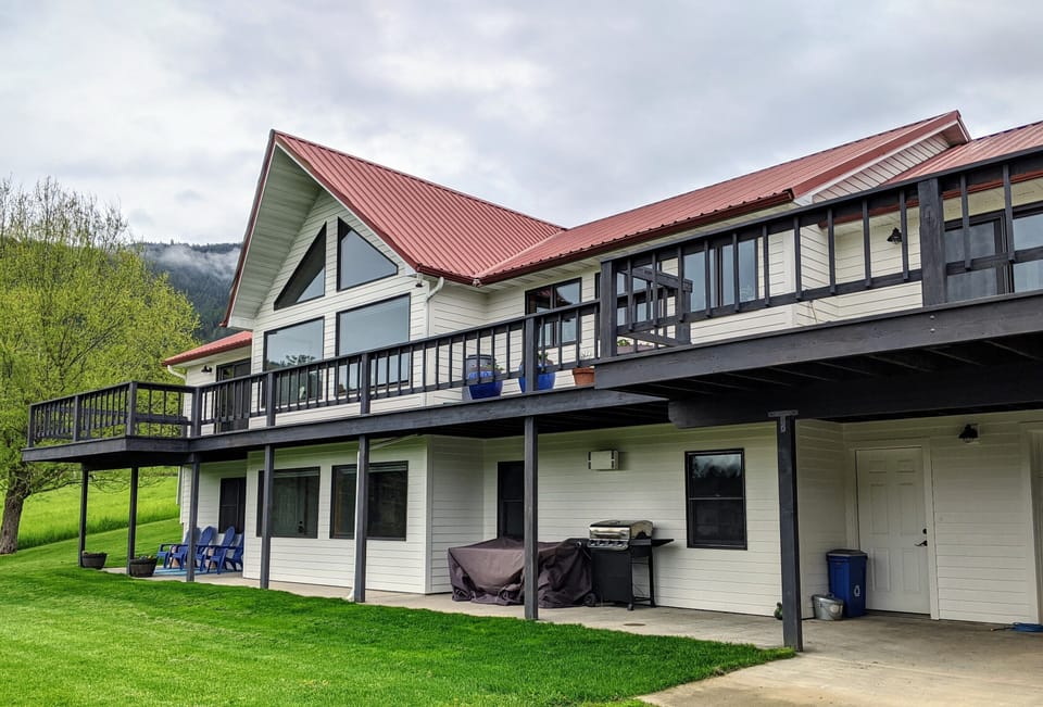 Lower level apartment includes a private patio, outdoor table, and gas grill.