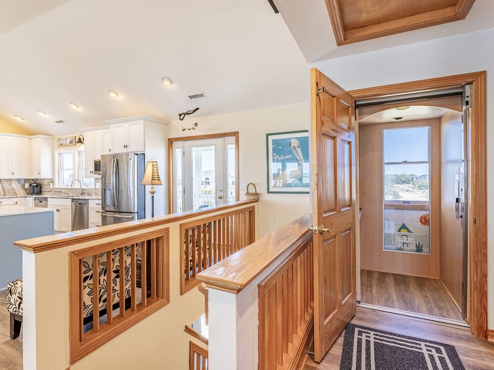Elevator has window view to outside. Elevator open to Upper Level Great Room