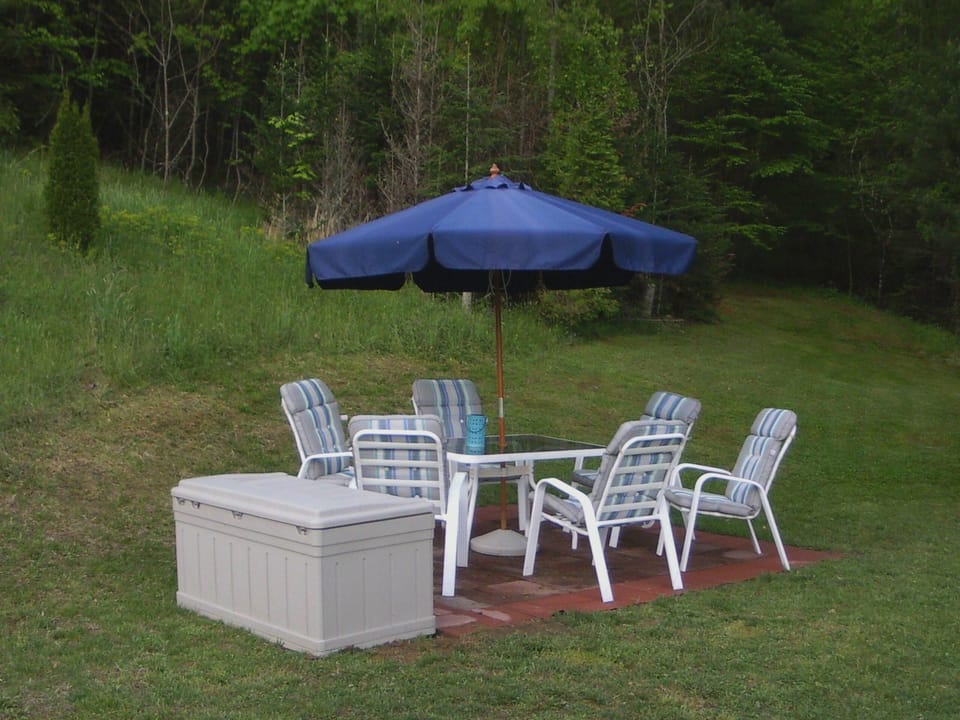 Patio at back of home.  Enjoy cooking on electric grill and eating outside.
