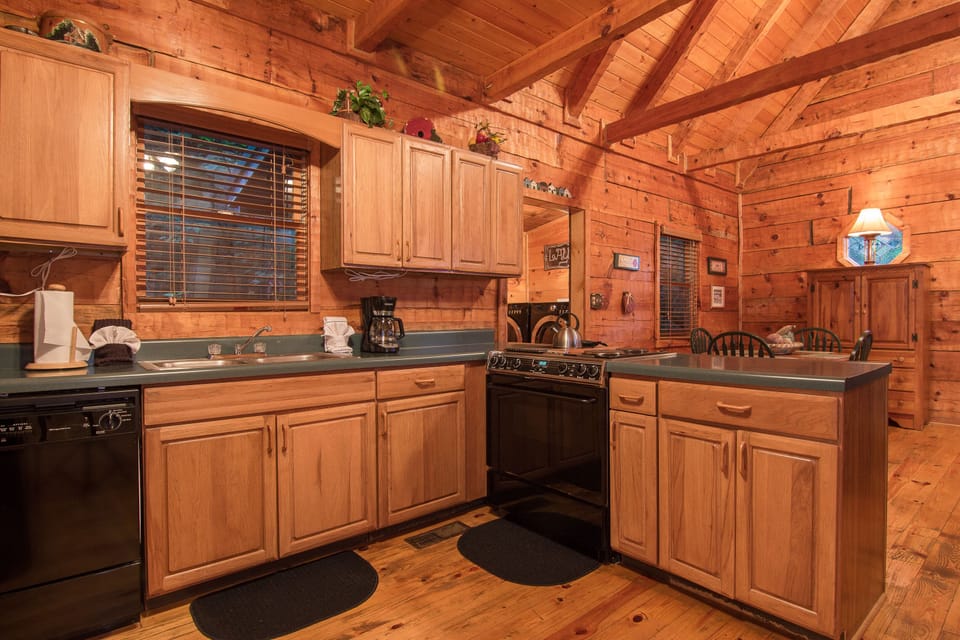 kitchen with coffee pot, stove, oven, dishwasher, microwave 