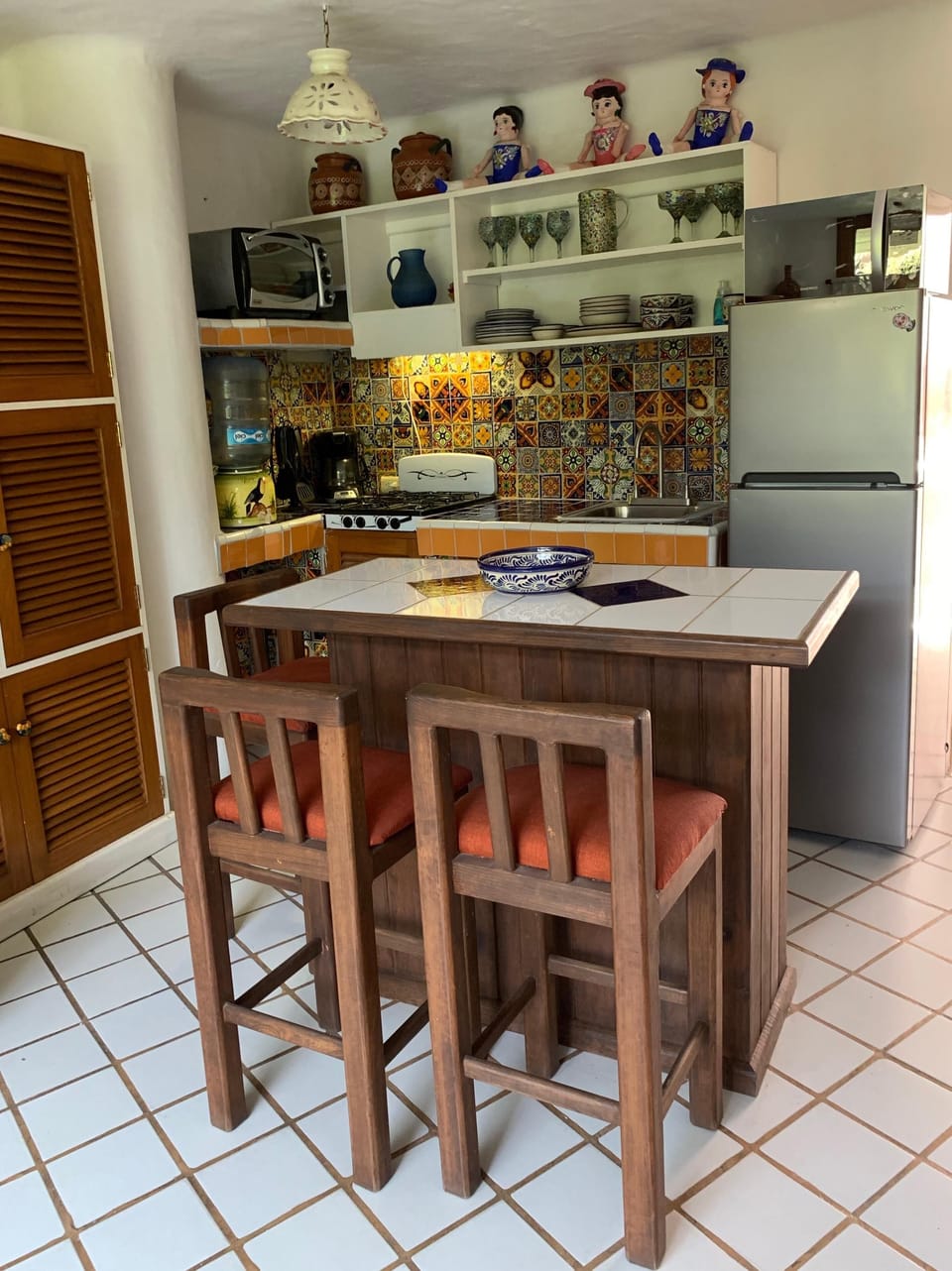 Newly remodeled kitchen featuring handmade artisanal tiles and new appliances.
