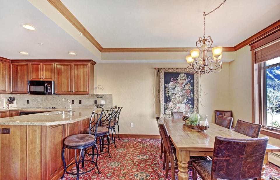 Dining for 6-8 people overlooking Center Village with mountain views.