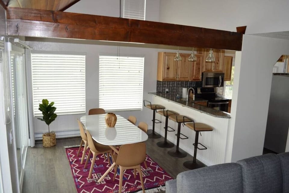 Spacious dining area seats 10 inside, with additional seating for 10 outside - perfect for large gatherings!