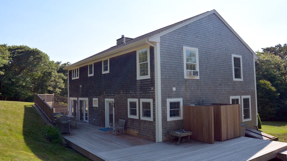 Expansive deck with enclosed outside shower.