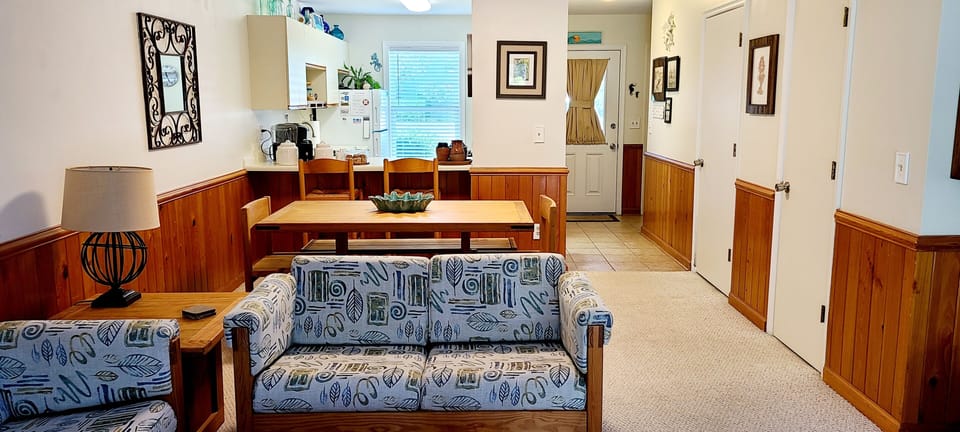 Living, dining, kitchen areas.