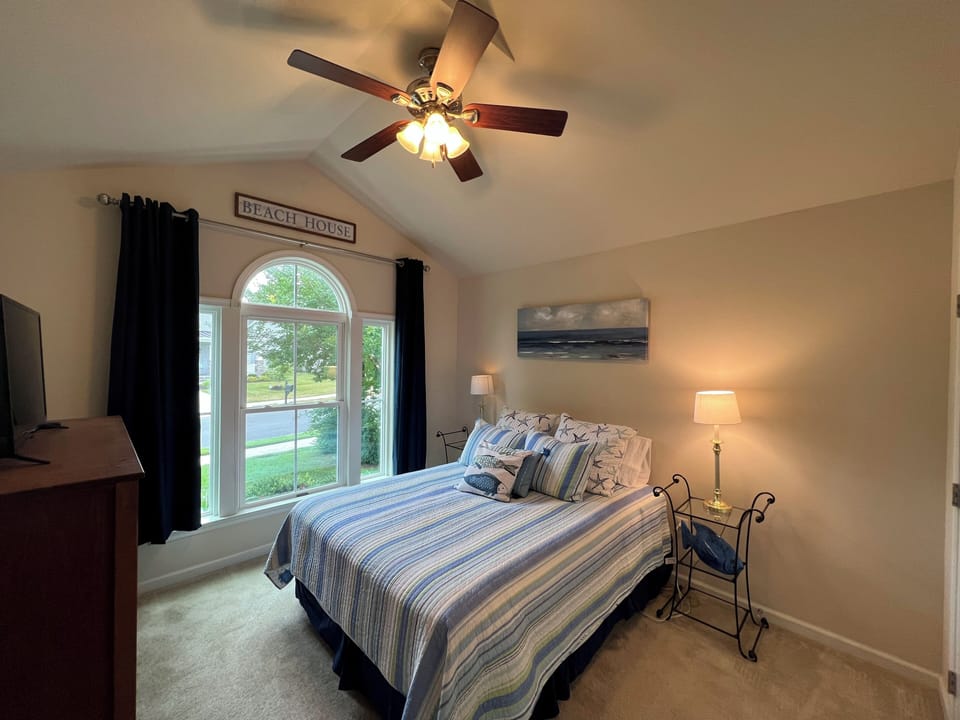 Bedroom is located in the front of the house just off the foyer and offers a Queen bed