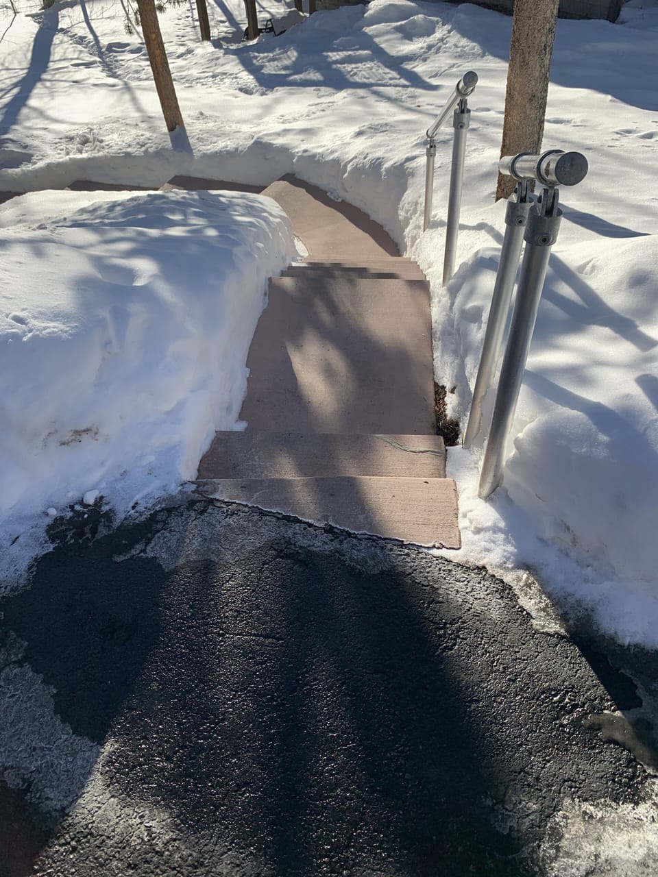 Top of walkway off of the right side of driveway that goes to the apartment