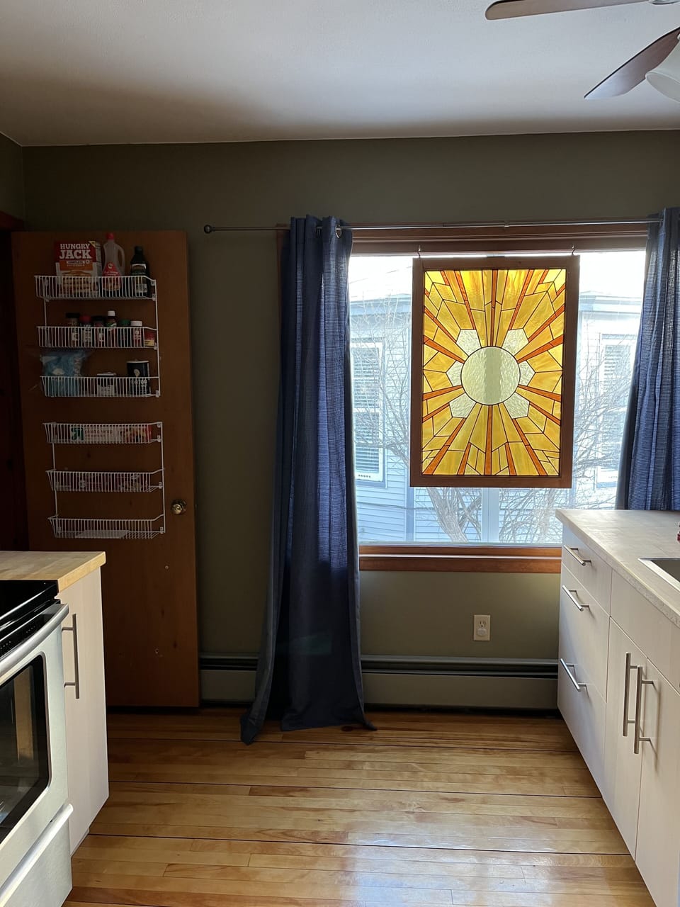 Beautiful stained glass window.  Pantry w/olive oil, salt/pepper, sugar/cinnamon