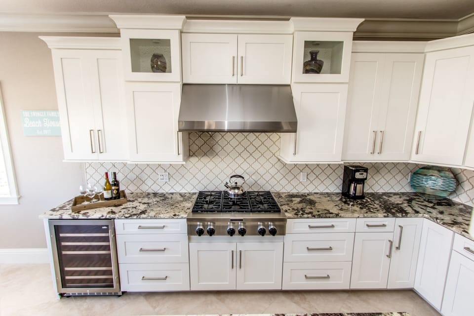 Kitchen with wine cooler and gas stove top