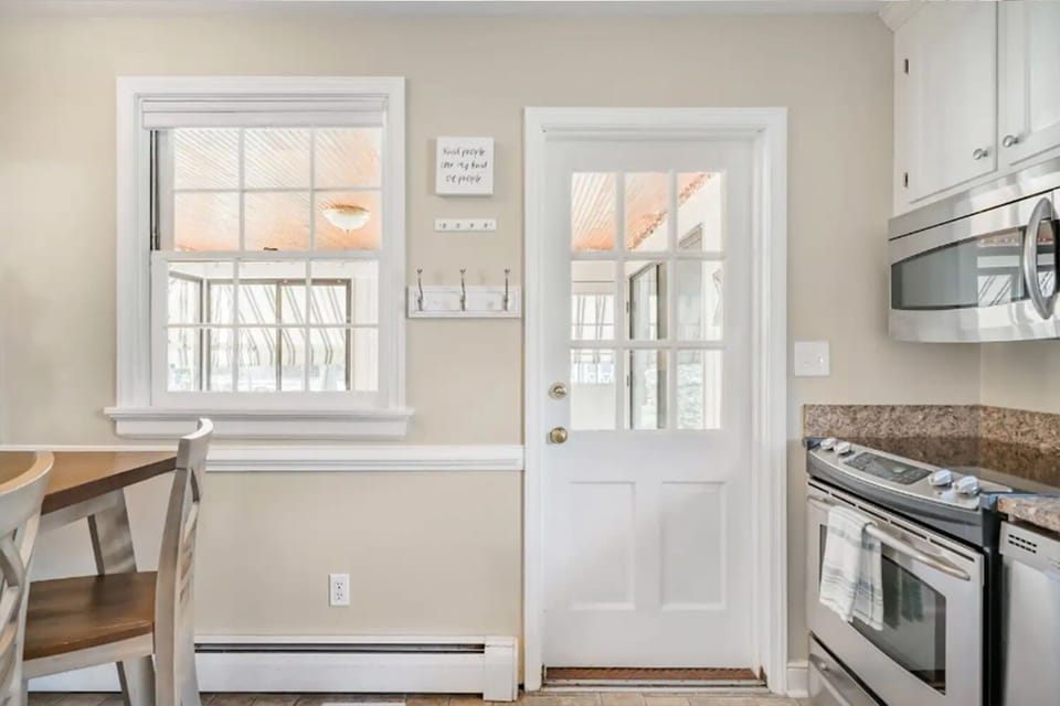 Newly renovated and fully stocked kitchen with stainless steel appliances.