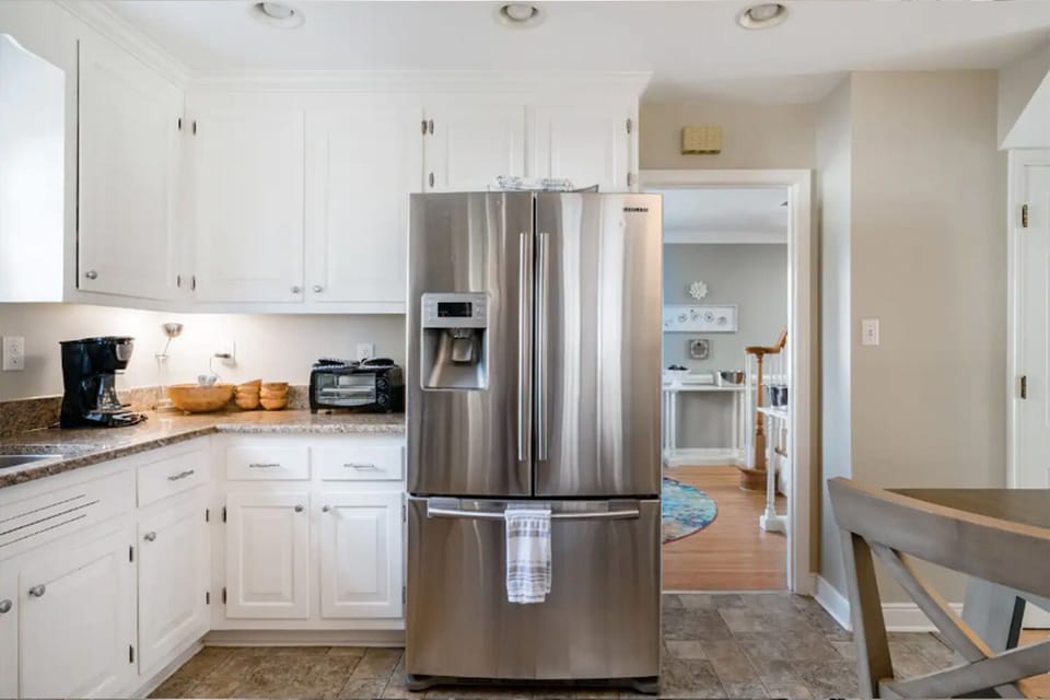 Newly renovated and fully stocked kitchen with stainless steel appliances.
