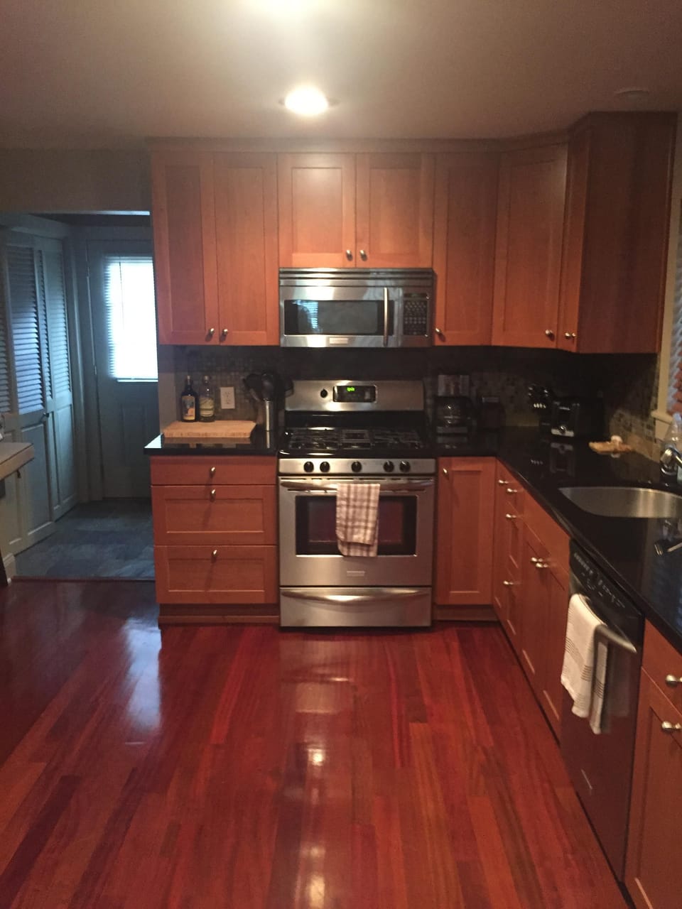 A kitchen perfect for making a meal; fully equipped, large dining table.