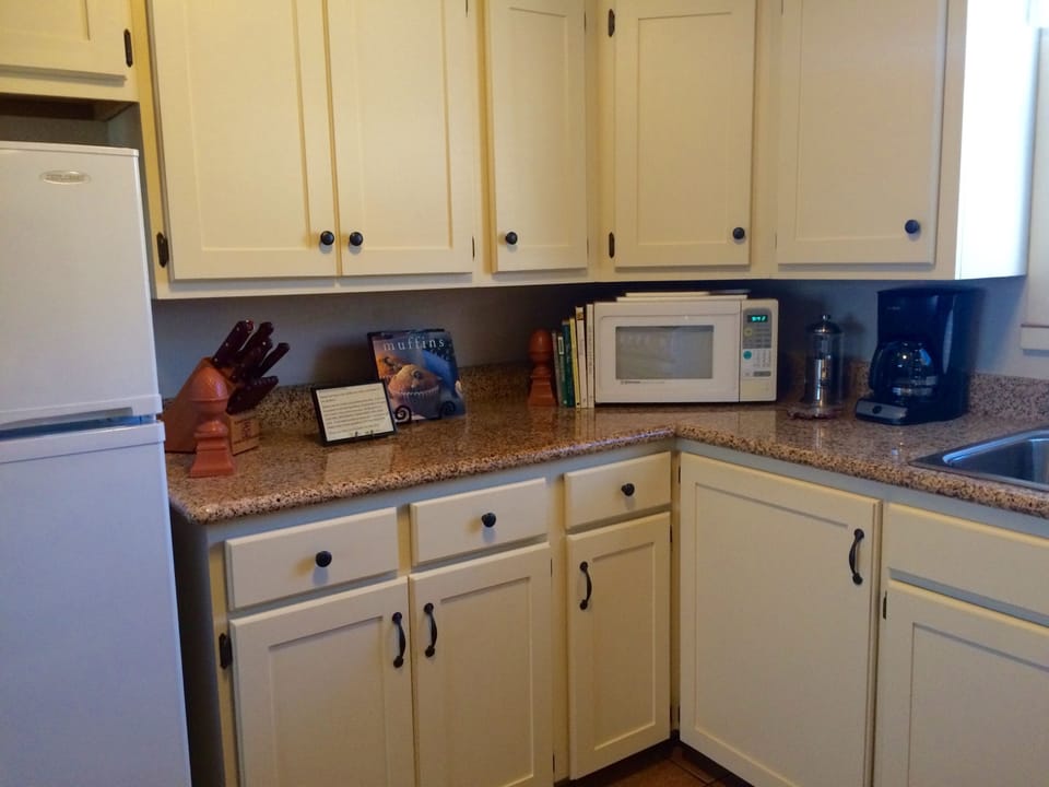 Kitchen; Granite counters, dishwasher,  Terra cotta dinner and Kitchen ware
