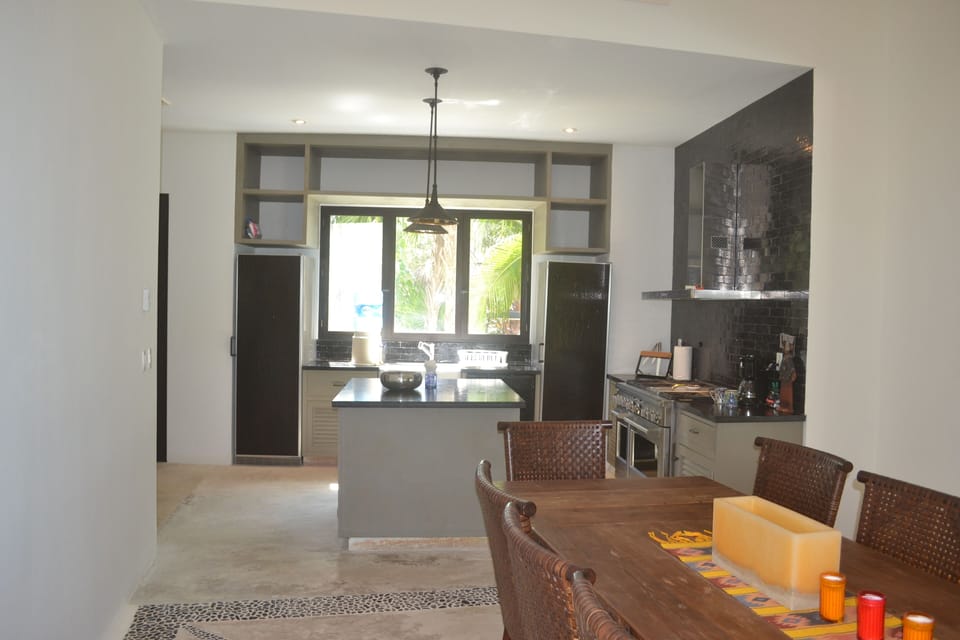 Fully equipped kitchen with 2 refrigerators, 6 burner stove/oven