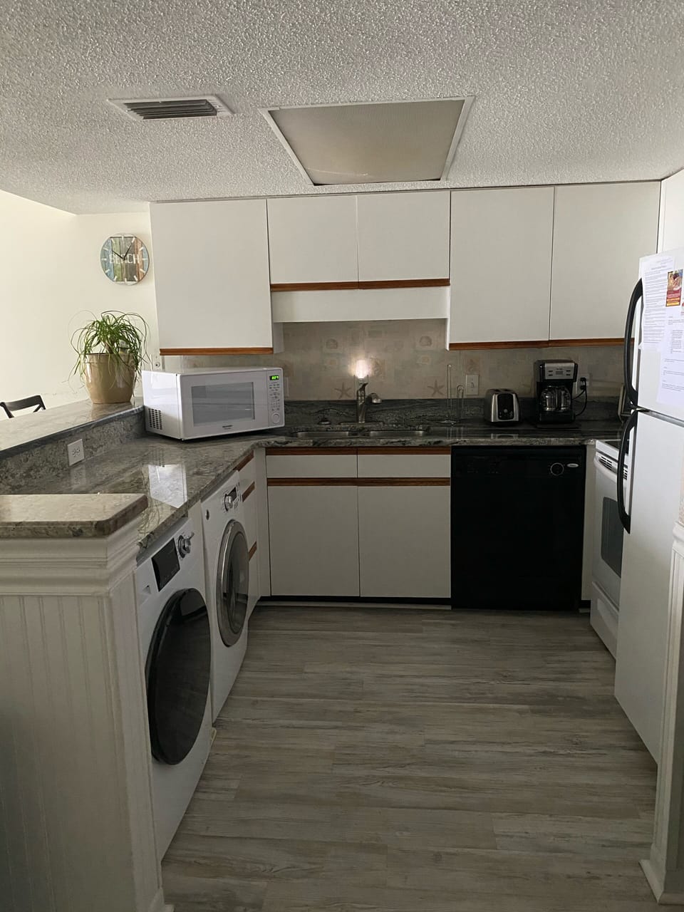Kitchen with washer and dryer 
