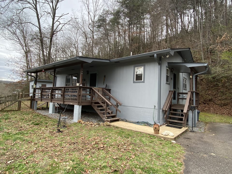 Fresh paint. New roof. Porch faces river and mountains. 