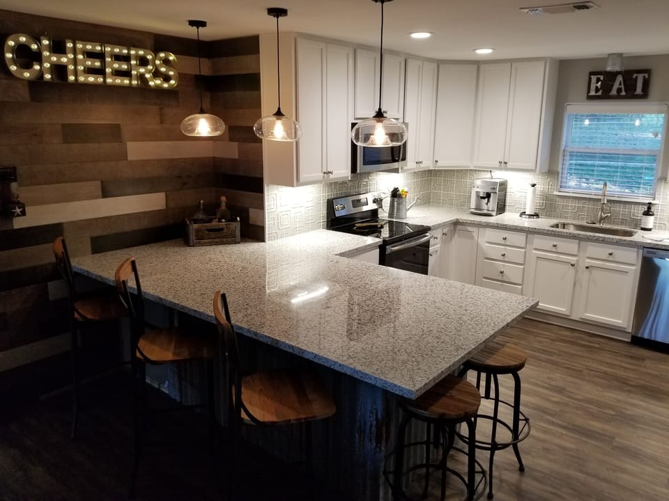 Large gourmet kitchen w/over-sized bar that easily seats 6 w/room for the Buffet