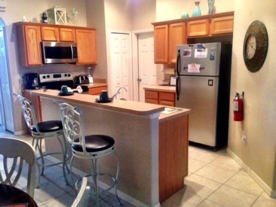 Kitchen with stainless steel appliances, sit up breakfast br, coffeemaker, blend
