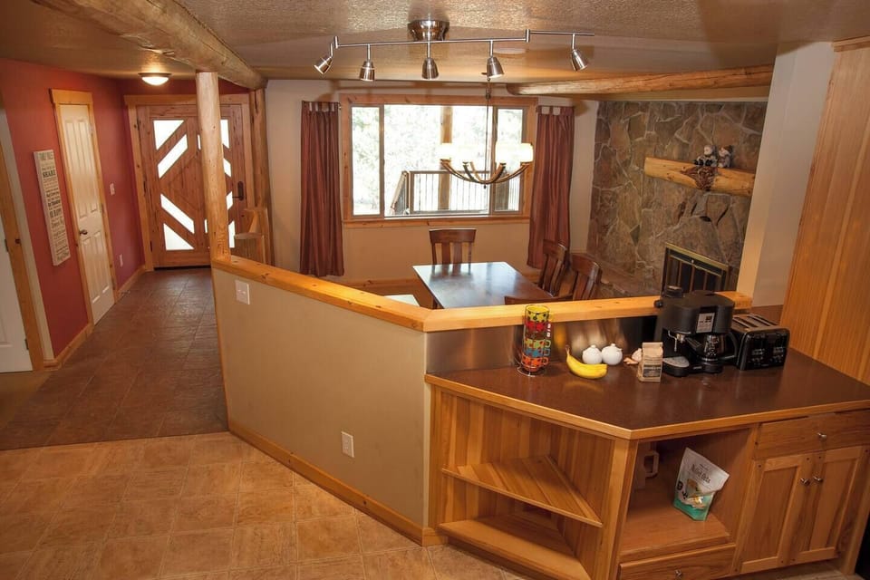 Kitchen looks over the sunken dining room (seats 8)