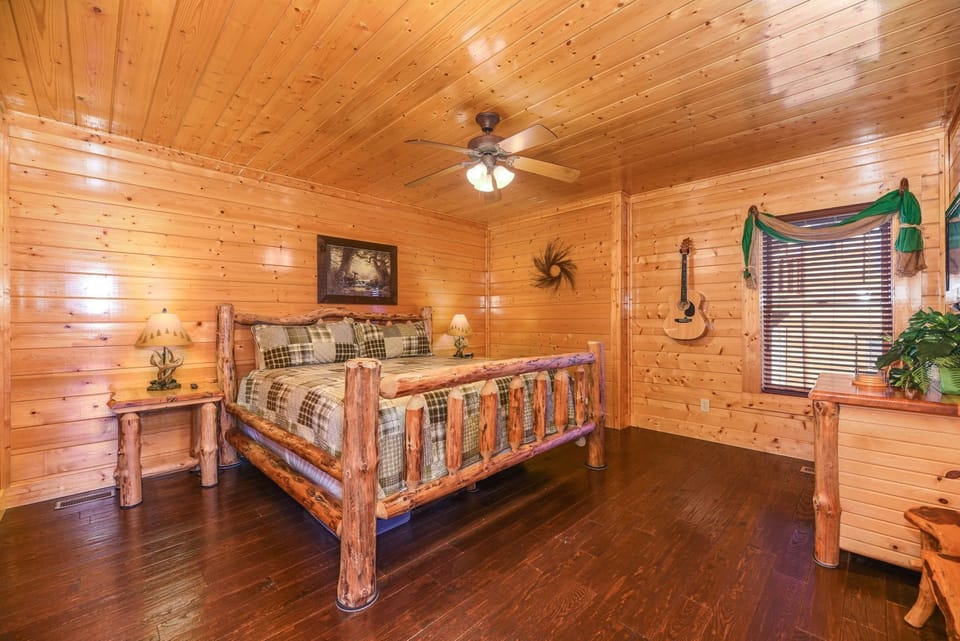 - Warm and inviting log bedroom with rustic furnishings and soft lighting   - Enjoy the charm of natural wood and serene mountain comfort   - A cozy space to relax, recharge, and feel right at home in the Smokies