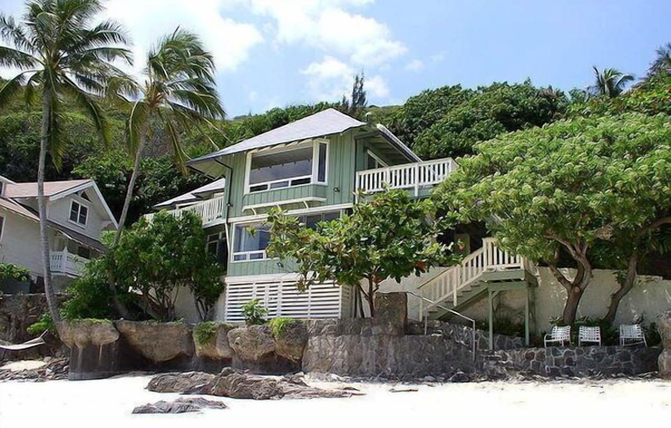 Front view of the house from secluded white sandy beach