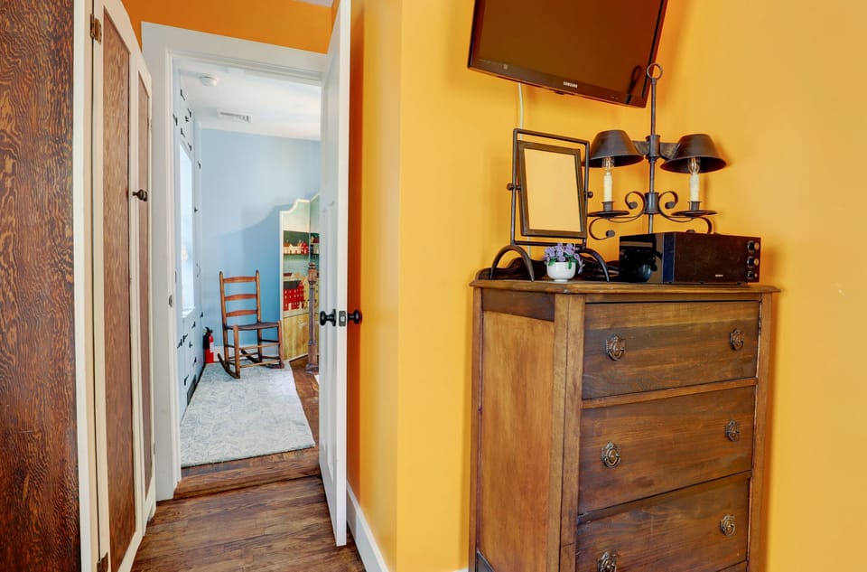 Guest Bedroom with Antique Bureau and Flat Screen TV