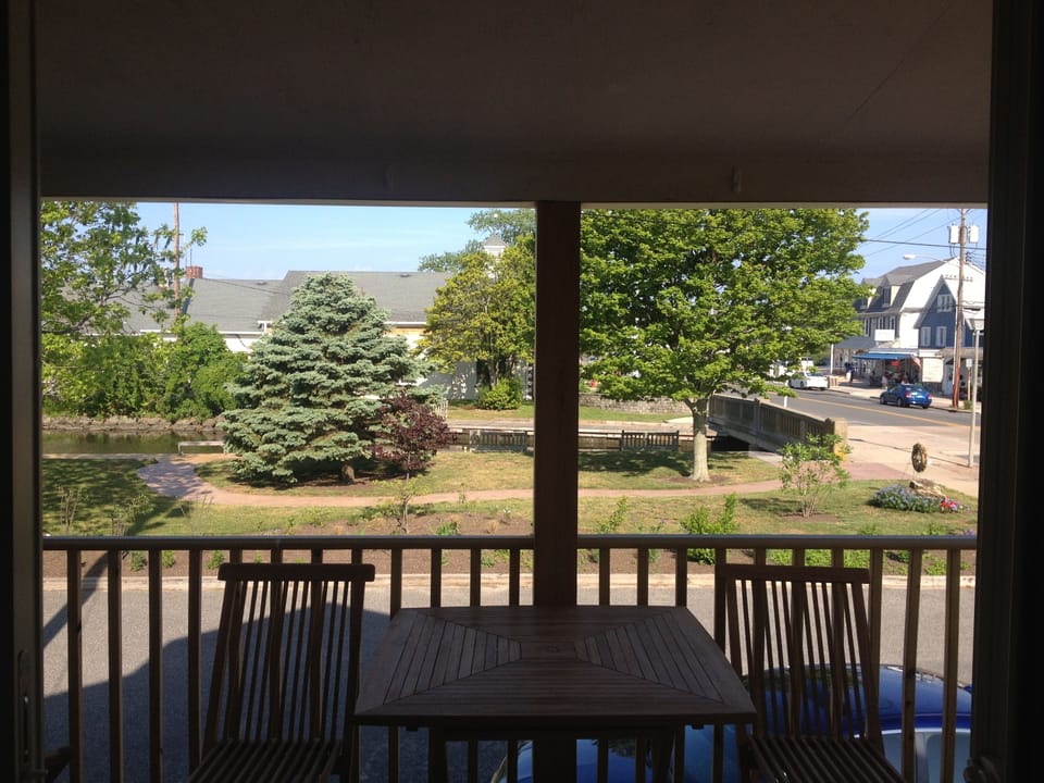 Back porch with a view of the channel and Muellers Bakery