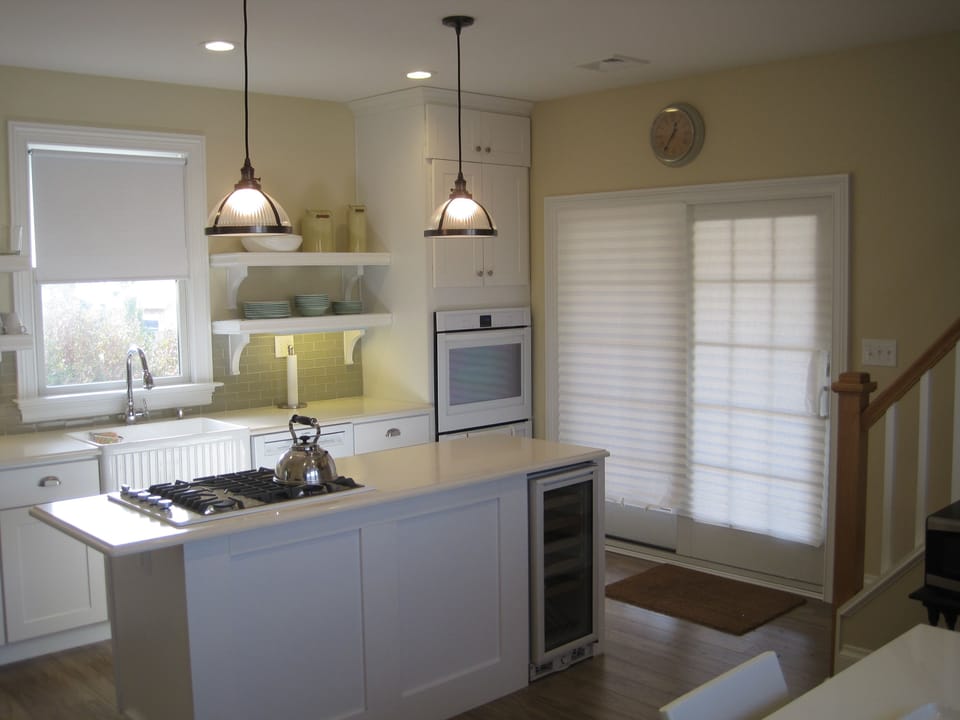 Eat-in Kitchen, double oven, dishwasher, gas cook top, wine fridge, farm sink.